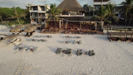 Tulum,-Mexico:-Amansala-resort-with-beachfront-huts-and-serene-palm-ambiance---Aerial