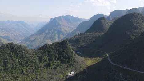 Drone-moves-sideway-to-reveal-windy-Ma-pi-leng-pass-and-marvelous-mountain-range-of-Ha-Giang-Viet-Nam