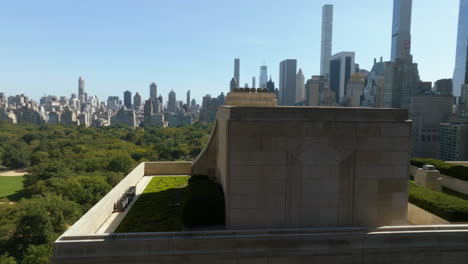 Aerial-view-orbiting-the-roof-of-the-15-Central-park-west,-in-sunny-New-York,-USA