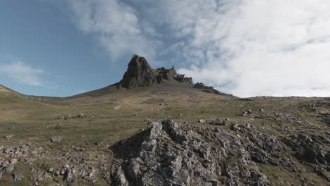 Flying-towards-sharp-spectacular-mountain-peak-in-summer,-Iceland