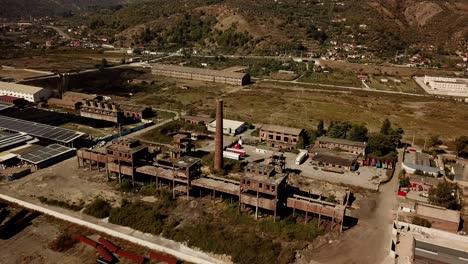 Drone-view-of-the-abandoned-metal-factories-at-Kombinati-Metalurgjik,-Albania,-Balkans,-Europe-Dolly-shot,-pull-in