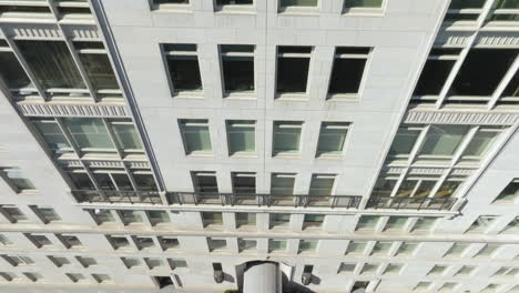 Aerial-tilt-shot-of-traffic-and-people-in-front-of-the-15-Central-park-west-facade-in-NY