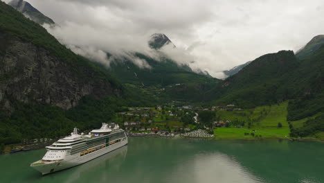 Luxury-cruise-ship-anchored-in-picturesque-fjord-of-Geiranger,-Norway