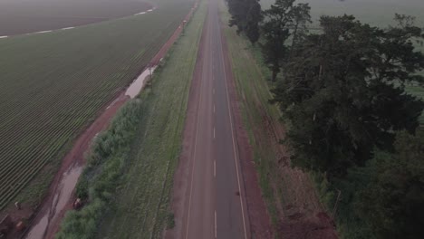 Drone-shot-of-vehicle-driving-on-the-open-road