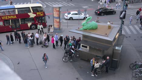 People-standing-in-line-for-street-food-at-a-Kiosk-at-Bitzinger,-Albertinaplatz,-Vienna---October-2023
