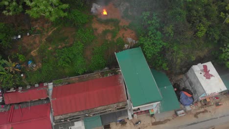 Top-down-view-of-campfire-at-Niem-son-Vietnam,-aerial