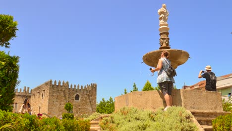 Tourists-photographing-the-garden-of-the-Archiepiscopal-Palace-of-Braga-in-Portugal