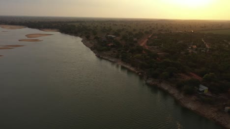 sunset-over-amazon-river-shore-in-severe-drought,-state-of-Para,-Brazil,-aerial-drone-shot