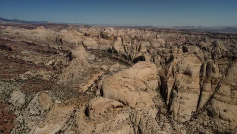 A-bird's-eye-perspective-of-Capitol-Reef,-featuring-the-distant-horizon