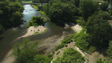 View-From-Above-Of-People-In-Zumbro-River-Near-Viaduct-Bridge-In-Oronoco,-Minnesota