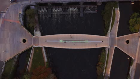 Aerial-Top-Down-View-of-Galway's-Salmon-Weir-Pedestrian-and-Cycle-Bridge-during-Twilight