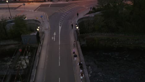 Aerial-top-down-tilts-up-following-the-bridge-and-revealing-the-Galway-Cathedral