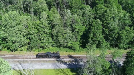 An-Aerial-View-of-an-Antique-Steam-Locomotive-Backing-Up-Slowly-to-Approach-a-Station-on-a-Sunny-Summer-Morning