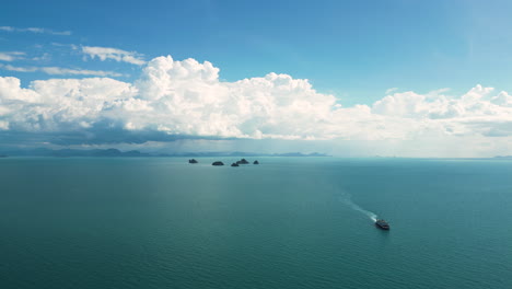 Chumpon-archipelago-islands-in-Thailand-with-sailing-vessel,-panoramic-aerial-view