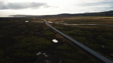 Jib-down-of-a-long-road-in-the-shadow-on-sunny-day-in-Iceland