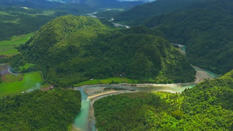 Drone-View-Panning-Down-Revealing-Beautiful-Valley-and-Daywan-River,-Surigao-Del-Norte,-Philippines