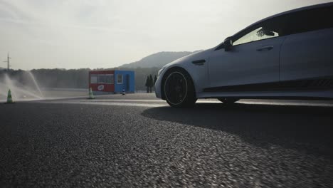 Mercedes-AMG-GT-63S-car-drive-to-start-safe-driving-school-lesson-wet-track