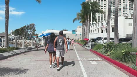 Marina-Embarcadero-and-Seaport-Village-in-Downtown-San-Diego-with-pedestrians-and-cyclist-on-coastal-promenade