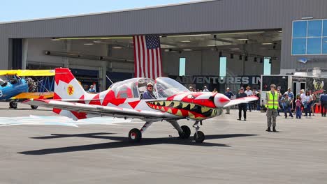Scottish-Aviation-SK-61-Bulldog-with-unique-paint-job-starting-up-in-front-of-a-hanger-at-an-airshow-at-Centennial-Airport-in-Colorado