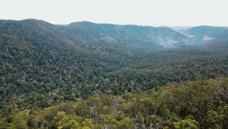 Drone-aerial-pan-down-in-an-Australian-mountain-valley-with-clouds