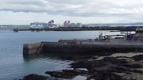 Aerial-view-looking-across-Holyhead-harbour-with-police-boat-and-Irish-ferry-ship-in-Welsh-port-terminal