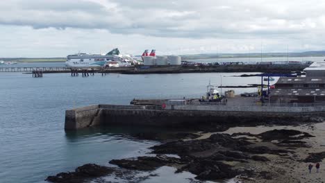 Aerial-view-towards-Holyhead-harbour-police-boat-and-Irish-ferry-ship-in-Welsh-port-terminal