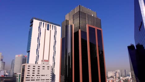 Drone-view-big-tall-buildings-Mexico-city-reforma-avenue-clear-blue-sky