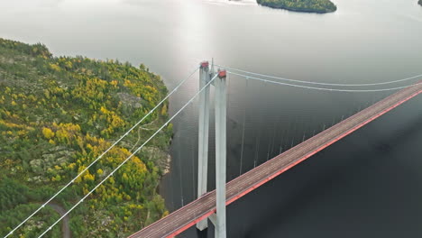 Above-View-Of-Suspension-Bridge-Of-Hogakustenbron-Over-Calm-Ocean-In-Sweden