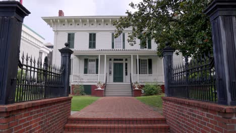 First-White-House-of-the-Confederacy-in-Montgomery,-Alabama-with-gimbal-video-walking-forward-in-slow-motion