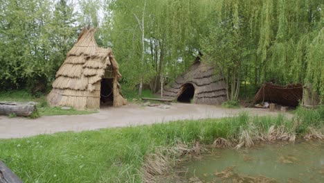 Bronze-Age-Hut-Replica-in-Biskupin,-Poland---Pan-Right