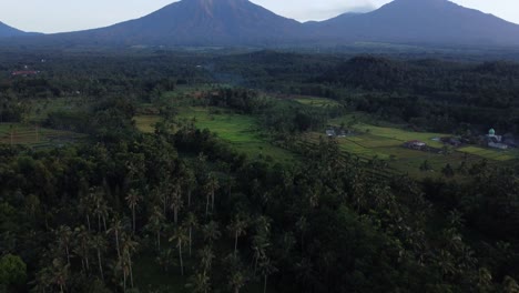 Aerial-view-unveiling-the-scenic-landscape-and-the-majestic-mountains-of-Licin-Area-near-the-beautiful-port-city-of-Banyuwangi-during-an-adventurous-trip-through-indonesia
