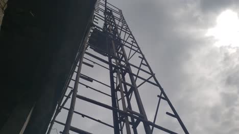 A-closeup-shot-of-a-construction-material-lift-or-open-lift-lifting-concrete-materials-for-pouring-on-a-building-slab