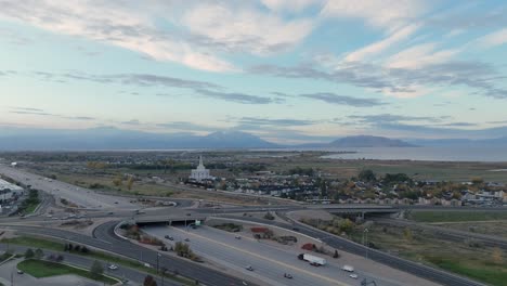 Orem-and-Provo,-Utah-along-Interstate-15-at-sunrise---pullback-aerial-reveal