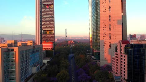 aerial-view-morning-Mexico-City-skyscrapers-reforma-avenue-golden-hour-clear-blue-sky