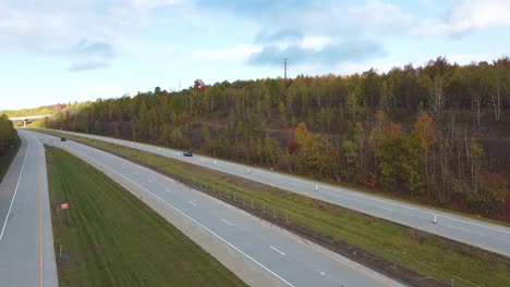 Drone-view-of-cars-passing-on-a-toll-road