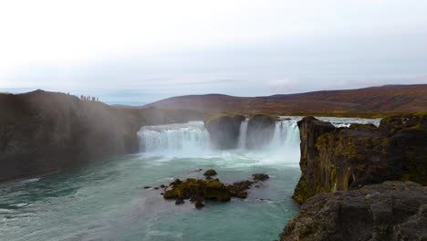 Aerial-revealing-shot-of-the-beautiful-Godafoss-waterfall-in-Iceland