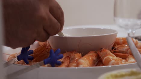 Taking-Shrimps-And-Mayo-From-Tray