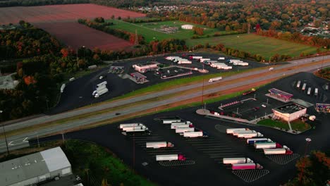 Amazing-aerial-of-a-truck-service-plaza-in-America,-where-semi-truck-drivers-eat,-sleep-and-shower