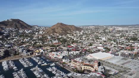 Aerial-over-the-city-of-Cabo-San-Lucas-and-the-marina,-Baja-California