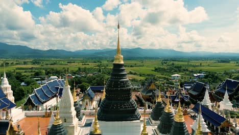 4K-Cinematic-nature-aerial-drone-footage-of-the-beautiful-temple-of-Wat-Ban-Den-in-the-countryside-of-Mae-Taeng-next-to-Chiang-Mai,-Thailand-on-a-sunny-day