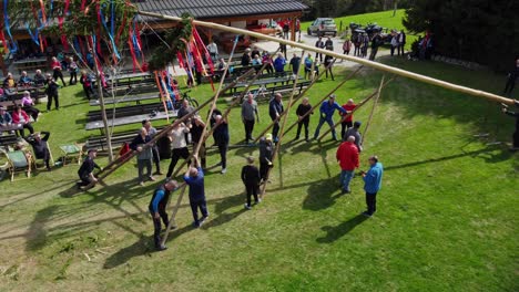 Slovenia,-local-people-celebrating-with-the-traditional-mlaj-maypole