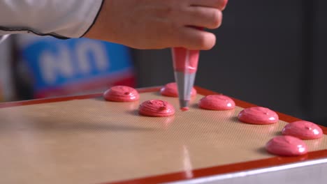 The-French-pastry-chef-forms-red-macarons