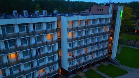 Descending-at-hotel-windows-at-twilight-with-some-windows-illuminated
