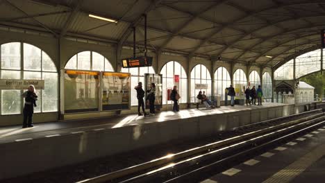 Beautiful-Light-in-Historical-Train-Station-Full-of-People-in-Berlin