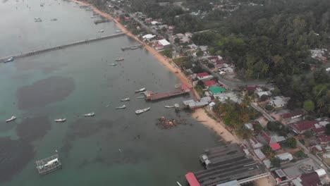 Wide-view-of-Tanjung-Binga-fishing-Village-in-Belitung-Island,-aerial