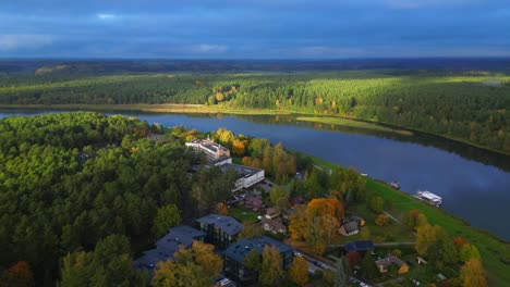 Orbit-over-Lithuanian-village-at-the-banks-of-Memel-river-during-suny-autumn-day