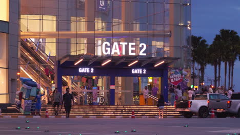 Front-view-Gate-2-of-Terminal-21-shopping-mall-with-Grand-Centrepoint-in-the-background,-in-Pattaya,-Chonburi-province,-Thailand
