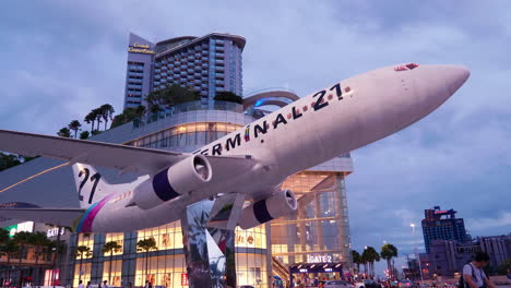 Front-view-of-Terminal-21-shopping-mall-with-Grand-Centrepoint-in-the-background,-in-Pattaya,-Chonburi-province,-Thailand