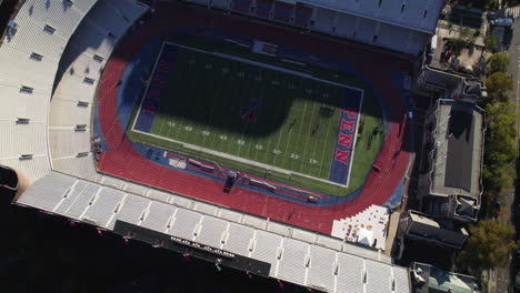 Aerial-view-tilting-away-from-the-Franklin-Field-stadium,-fall-evening-in-Philadelphia