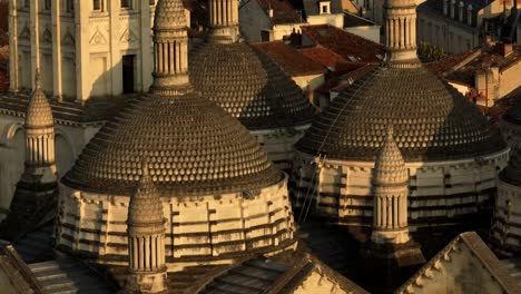 Dome-of-Saint-Front-Cathedral-in-Périgueux,-close-up-drone-view-at-sunrise,-Dordogne,-Nouvelle-Aquitaine,-France